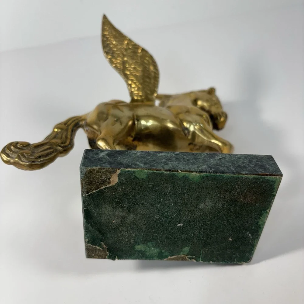 vintage solid brass Pegasus figurine mounted on a green marble base,